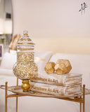 Unique book-themed decor adding a stylish touch to shelves and tabletops.