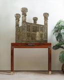 A beautifully crafted sculpture adds artistic elegance to this sophisticated living room, handmade in Lahore.