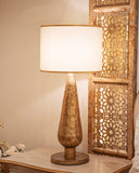 A stylish lamp brightens this elegant living room, adding warmth and charm with its unique design and soft glow.