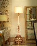 A stylish uplighter enhances the ambiance of this elegant living space with soft, inviting light and contemporary design.