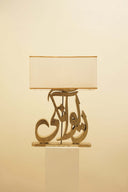This handcrafted lamp brings a soft, warm glow to a luxurious living room, reflecting the skilled artistry of Lahore, Pakistan.