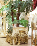 A beautiful planter adds natural greenery and elegance to this stylish living room, handmade in Lahore.