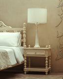 Decorative bedside lamp casting a warm glow, ideal for creating a calming nighttime ambiance.