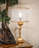 Elegant lamp placed in a refined interior setting, adding warmth and character to the space — handmade in Lahore.