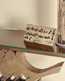 A detailed view of the writing plate on the console, showcasing its unique lettering and thoughtful design detail.