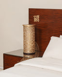 A beautiful lamp adds ambiance to this luxurious setting, showcasing handmade craftsmanship from Lahore.