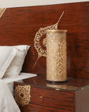 Lamp beside jhoomer bed set casting warm light for a calm, inviting space.