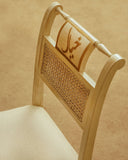 Close-up of the Jhoomer Writing Desk chair highlights its elegant curves and finely upholstered seat, reflecting refined craftsmanship from Lahore.