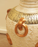 A close-up of a terracotta piece showcasing its rich texture and earthy tones, bringing organic warmth to the room’s decor.