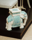A decorative Elephant Stool adds whimsical elegance and handcrafted character, echoing regional craft influences from Lahore.