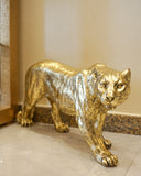 The sculpture adds a unique focal point to this sophisticated living space, showcasing fine craftsmanship.