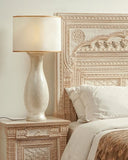 Soft-lit bedside lamp next to Rivaj Bed Set creating a calm evening mood.