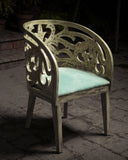 Comfortable seating chair next to a sleek side table, perfect for any modern home or office space.