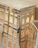 Close-up of detailed craftsmanship on the chest, highlighting fine textures and design in this refined living space.