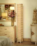 A striking uplighter lamp brightens this elegant living room, handmade in Lahore, adding warmth and style to any space.