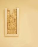 The Shehr-e-Zaat Clay Frame adds a refined, cultural accent to a luxurious living room, blending sculptural beauty with modern decor.