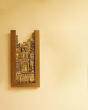 A striking Shehr-e-Zaat Clay Frame displayed in an elegant interior, evoking a sense of serenity and craftsmanship.