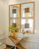 A sleek plain mirror set adds a clean, modern accent to this refined living room space.