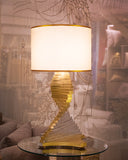 A beautiful lamp brightens the elegant living room, showcasing intricate design, handmade in Lahore.