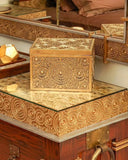 Decorative jewelry box on dresser near zaviya bed set.