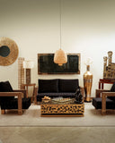 Stylish sofa set with rich upholstery, layered textures, and curated accessories, offering comfort and sophistication.