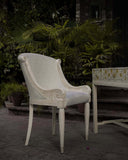 Noor Hand-Painted Chair in a refined study or living room setting, featuring intricate craftsmanship and artistic detail from handmade furniture of Lahore, Pakistan.