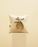 Beige pillow with gold sufi design on a beige background, 