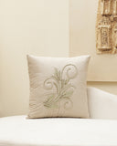 Decorative pillow with floral embroidery on a beige background