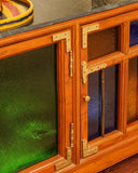 Close-up of the detailed craftsmanship and textured finish on the sideboard, showcasing expert design.


