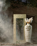 Terracotta and brass standing mirror frame with a modern, earthy design, perfect for elevating any room.