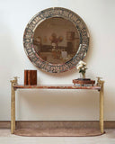 A stylish clamp console paired with a round mosaic frame adds a touch of elegance and modern sophistication to this Lahore living room.