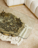 Glass coffee table with architectural model design in a living room setting