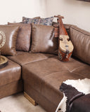 A luxurious sofa set complete with side tables, throw pillows, and warm lighting for a cozy, upscale look.

