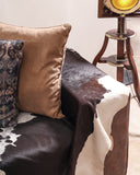 Modern sofa set paired with decorative trays and floor lamps, designed for a sophisticated space.

