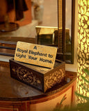 Close-up of the writing plate, showcasing intricate engravings and delicate craftsmanship within this elegant interior