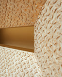 A close-up of the console highlights its rich texture and finely crafted surface details.