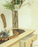 Close-up of carefully arranged desk accessories, adding character and practicality to the workspace.
