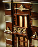 Close-up of the Faisalabad Clock Tower showcasing intricate woodwork and elegant design details for home decor.