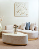 This refined sofa set enhances the warm ambiance of the living room, featuring the same classic design but newly upholstered in a different fabric, carefully crafted in Lahore.