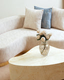 A close-up of the sofa cushions highlights the new fabric’s soft texture and refined detailing.