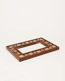 A beautifully crafted decor tray adds elegance and charm to this sophisticated living room, handmade in Lahore.
