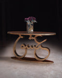Decorative table with intricate design on a dark background, featuring the brand 'Kalamkaar'.