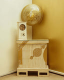 Elegant Jhoomer Chest with Peacock Pendant Light in a luxurious living room setting, featuring handmade furniture from Lahore, Pakistan.

