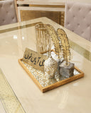 A beautifully crafted dining set enhances the elegance of this sophisticated space, handmade with care in Lahore.