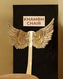 Elegant Khambh Chair in a luxurious living room setting, featuring handmade furniture from Lahore, Pakistan.

