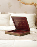 The Khazana Jewelry Box, displayed with its lid open, reveals its intricate craftsmanship and timeless charm amidst a luxurious living room adorned with handmade décor from Lahore, Pakistan.