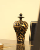 A handcrafted Naqashqari urn displayed in a luxurious living room, showcasing exquisite artisan decor from Lahore, Pakistan.


