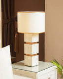A stylish lamp brings warm ambiance and elevates the décor of this sophisticated living room, handcrafted in Lahore.