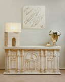 A beautifully crafted sideboard from Lahore offers graceful storage while elevating the style of this polished living room.