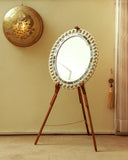 Elegant mirror frame detail enhancing the luxurious feel of a stylish living room setting.